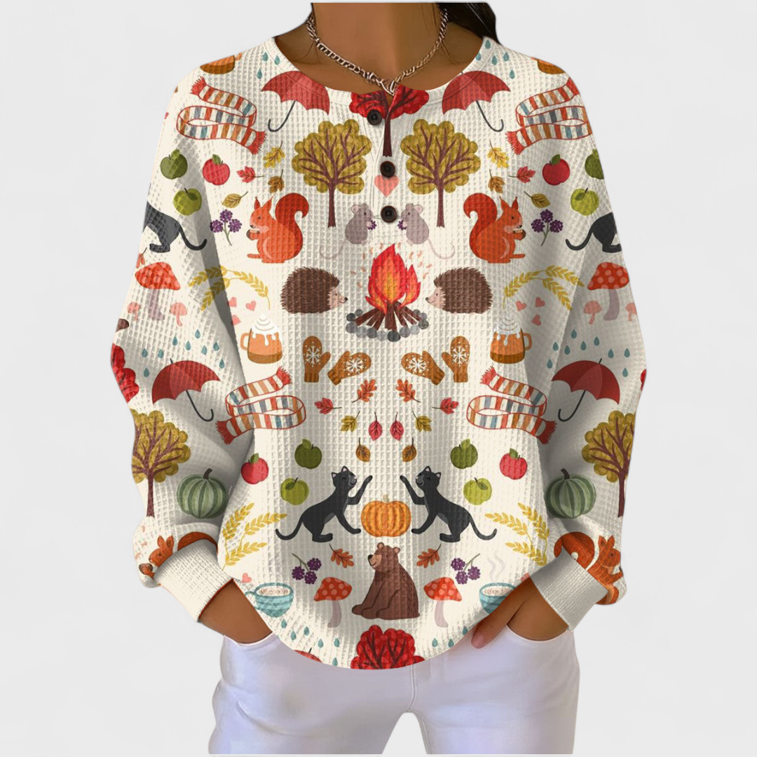 Alma - Cremefarbener Pullover mit herbstlichem Waldmotiv